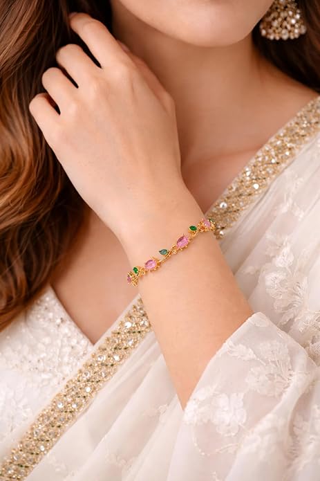 Close-up of a woman's hand wearing Anti-Tarnish, gold plated tulip bracelet with pink and green zirconia
