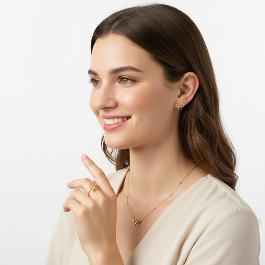 Woman wearing Sweet Bow Love Set – Anti-tarnish 18k Gold-plated Bow Chain Pendant, Bow Earrings & Bow Ring Set