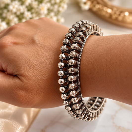 model wearing Oxidised Black & Silver Polished Ball Detail Ethnic Bangles for Women