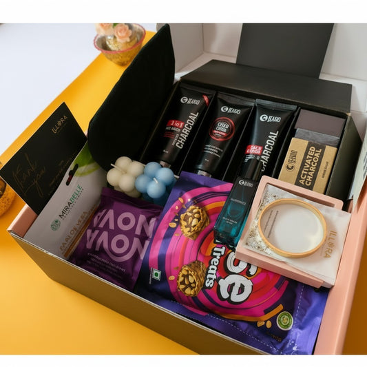The Alfa Glow Grooming & Self-Care Gift Hamper For Men in a open premium mailer box