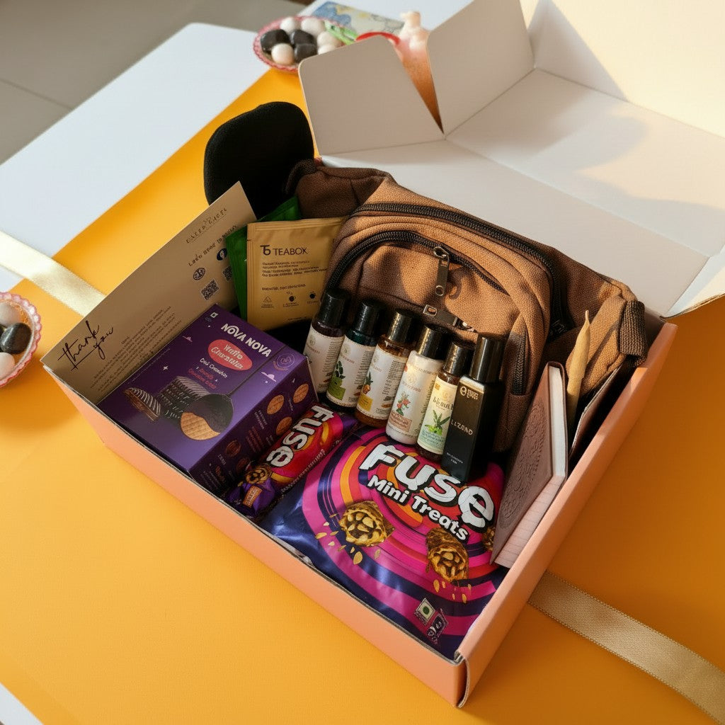 Gifts for him with travel care products, accessories and sweet treats on a yellow surface