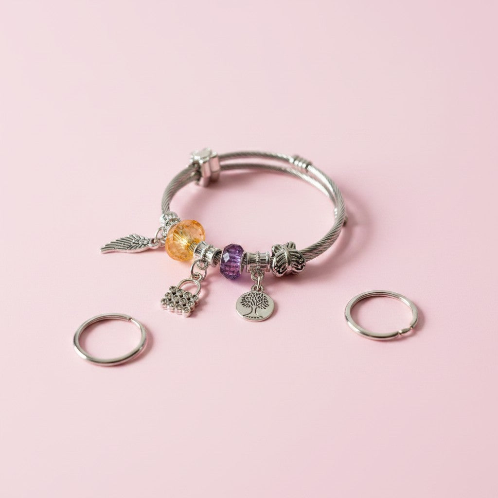 Anti-tarnish Silver-plated Charm Bracelet & Hug Ring on a pink background