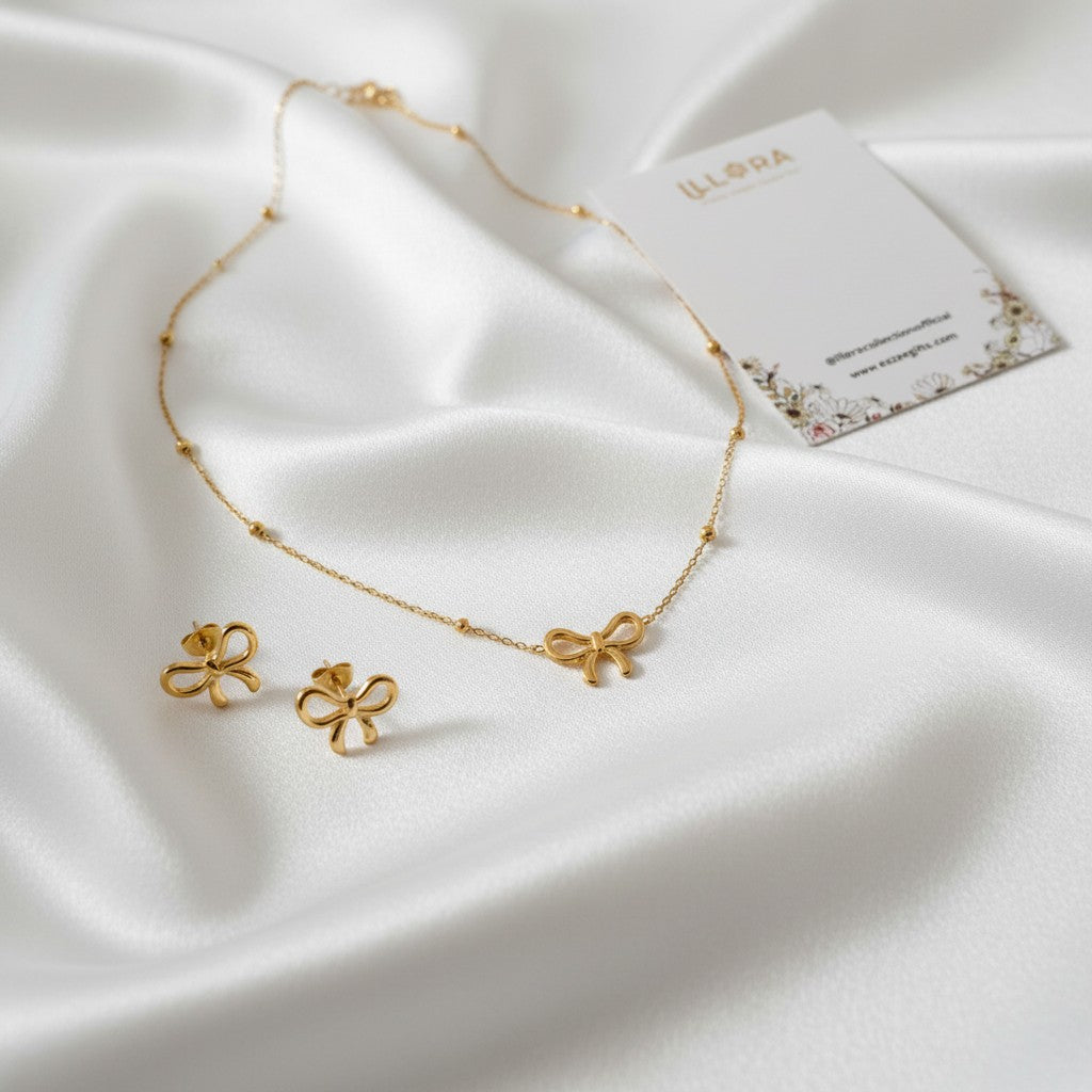 Sweet Bow Muse Duo – Anti-tarnish 18k Gold-plated Bow Chain Pendant & Bow Ear Studs on a white fabric background