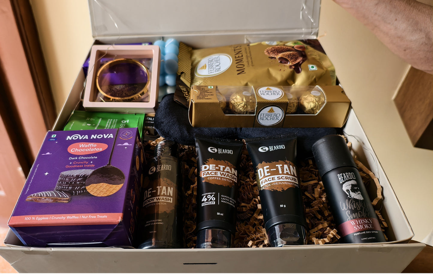 Close-up of The Tidal Gentleman Grooming & Self-Care Gift Hamper For Men in a luxury hamper box