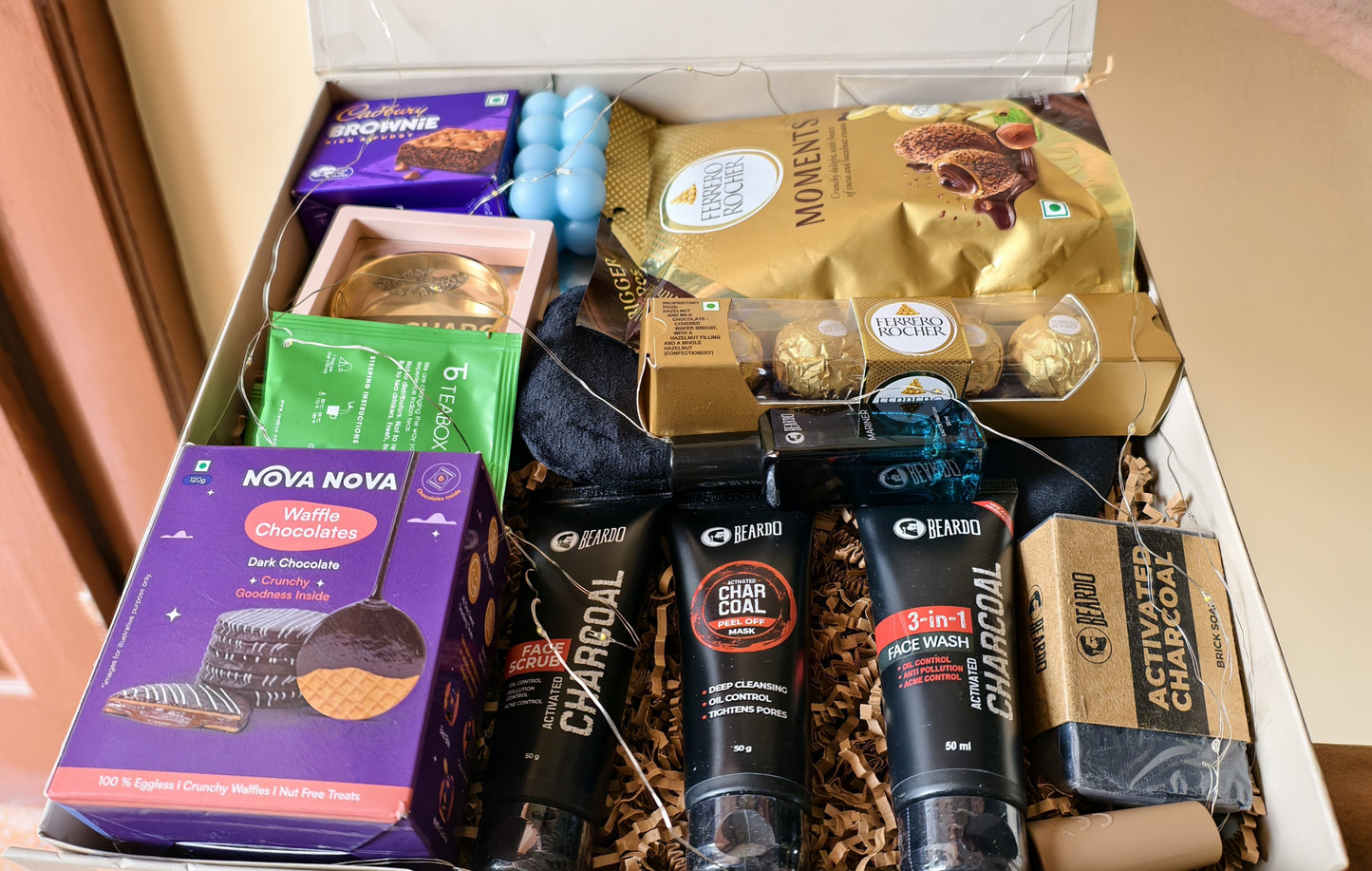 Close-up of The Alfa Glow Grooming & Self-Care Gift Hamper For Men in a luxury hamper box.