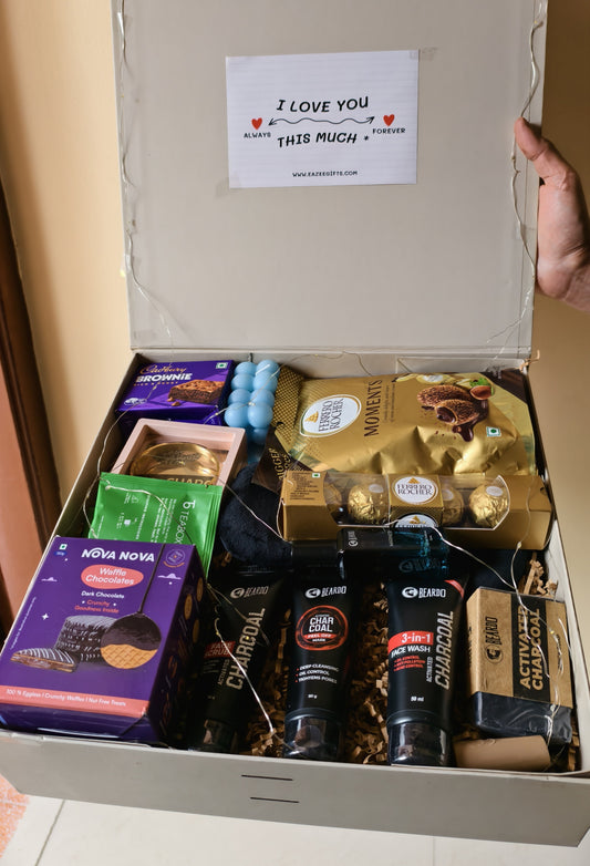 The Alfa Glow Grooming & Self-Care Gift Hamper For Men in a luxury hamper box, with a 'I LOVE YOU THIS MUCH' card on top.