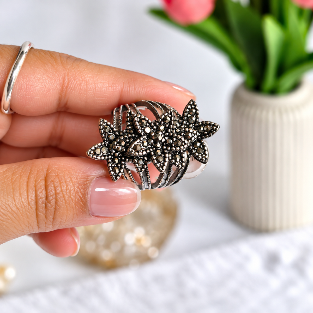 horizontal view of Oxidised Black & Silver Polished AD Floral Chunky Statement Ring for Women 