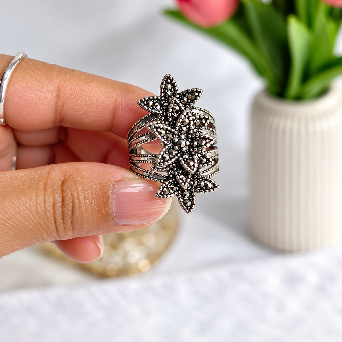 vertical view of Oxidised Black & Silver Polished AD Floral Chunky Statement Ring for Women 