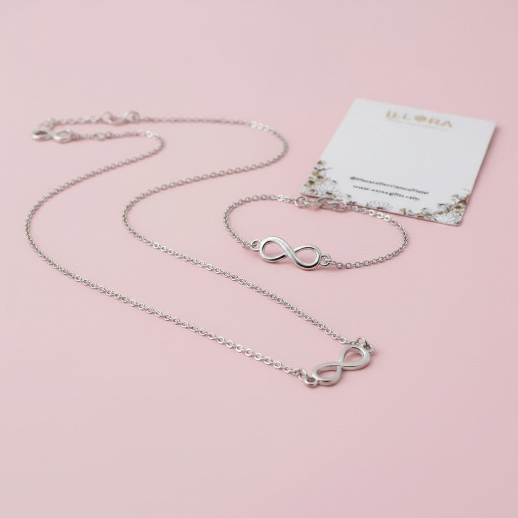 Silver-plated Infinity Chain Pendant & Infinity Bracelet on a pink background