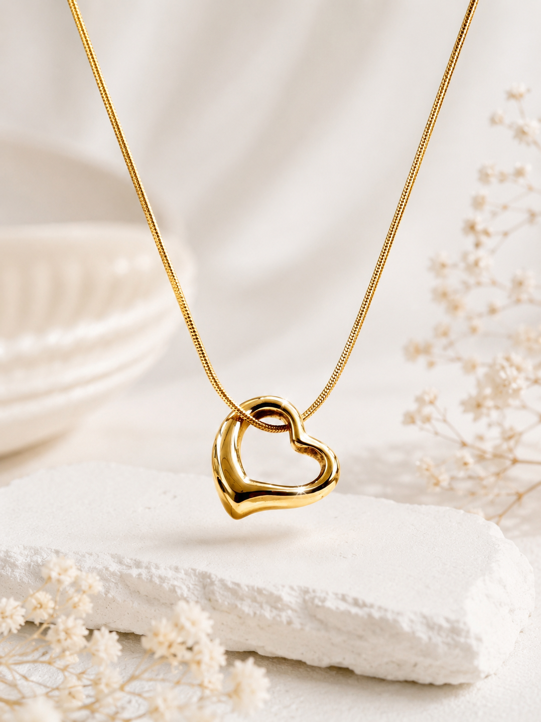 Close up of Aurelia Gold Plated Anti Tarnish Tilted Heart Necklace