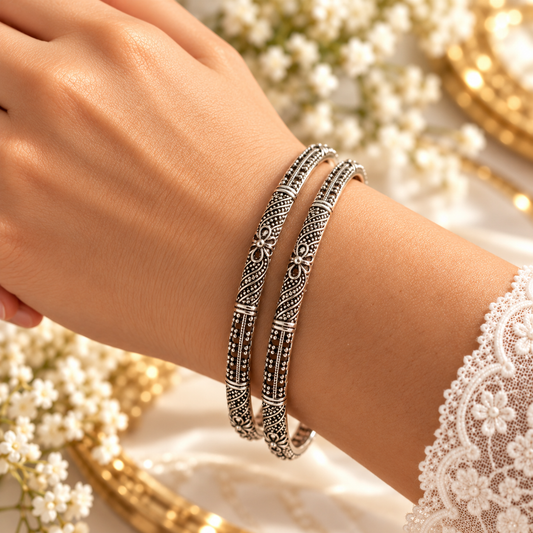model wearing Oxidised Black & Silver Polished Floral Design Ethnic Bangles for Women