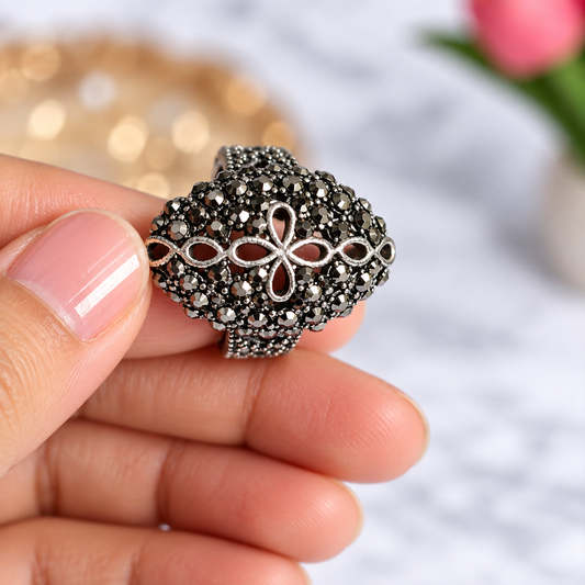 Horizontal view of Oxidised Black & Silver Polished AD Floral Dome Statement Ring for Women