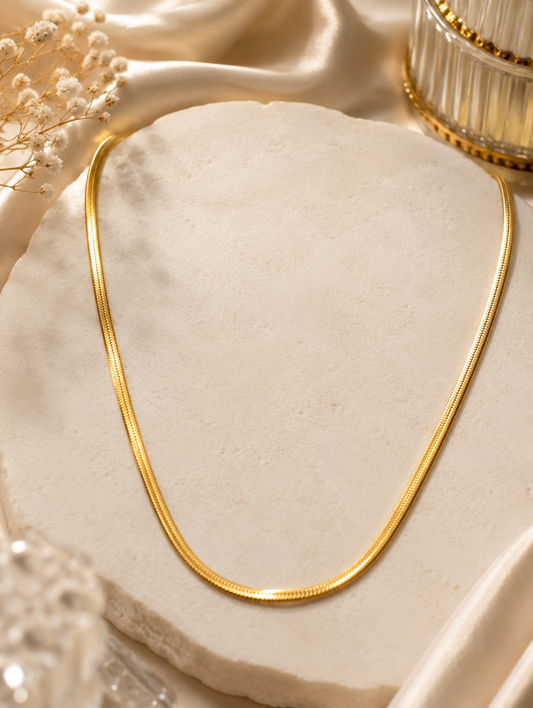 Serpentina Herringbone Gold Plated Anti Tarnish Snake Chain Necklace for Women on satin fabric background