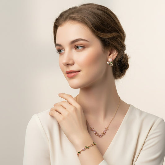 Woman wearing Tulipa Blush & Bloom Gold Plated Anti-Tarnish Jewellery Set for Women with matching Pink Tulip Necklace, Bracelet & Earrings on a plain background