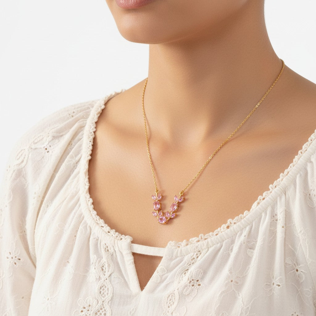 Anti-Tarnish, gold plated tulip necklace with pink zirconia wore by a model against a white background