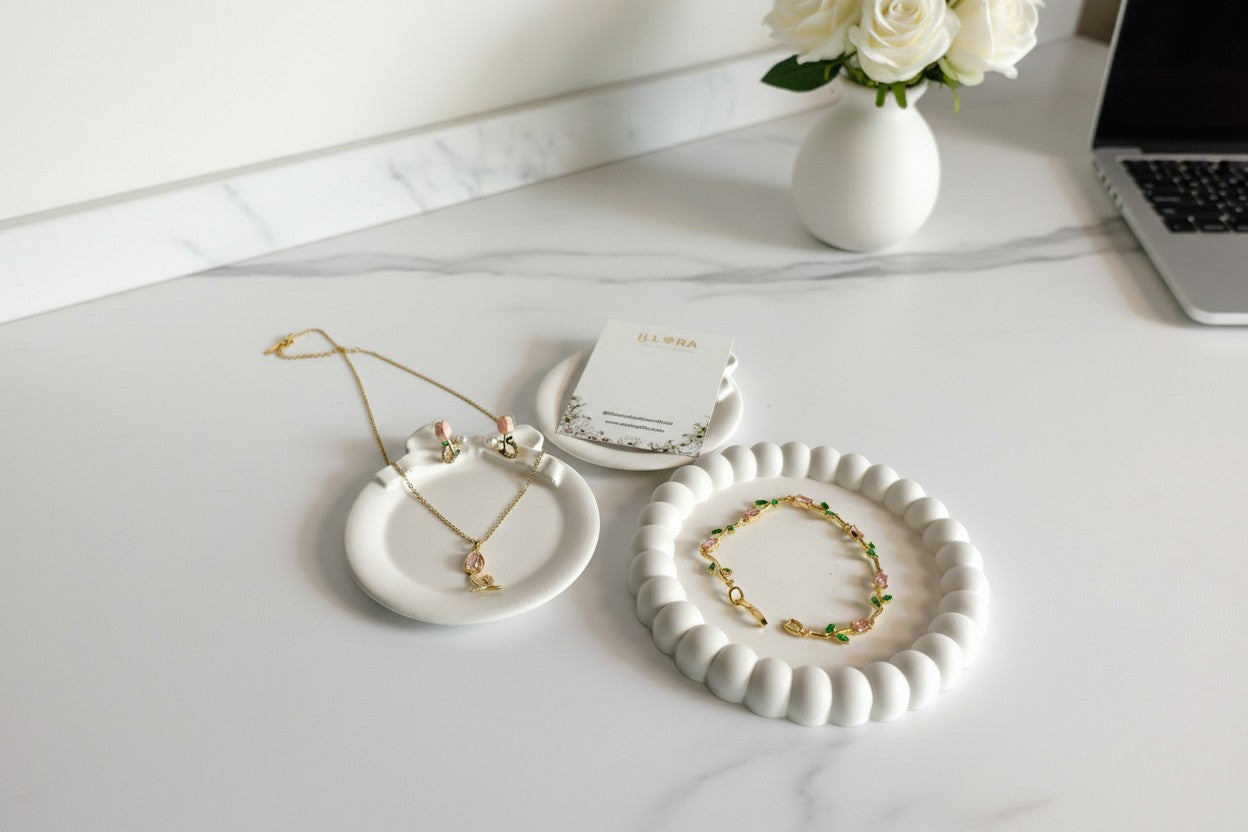 Tulipa Petal Muse Gold Plated Anti-Tarnish Jewellery Set for Women - Pink & Green Tulip Pendent Necklace, Bracelet & Earrings on a white surface