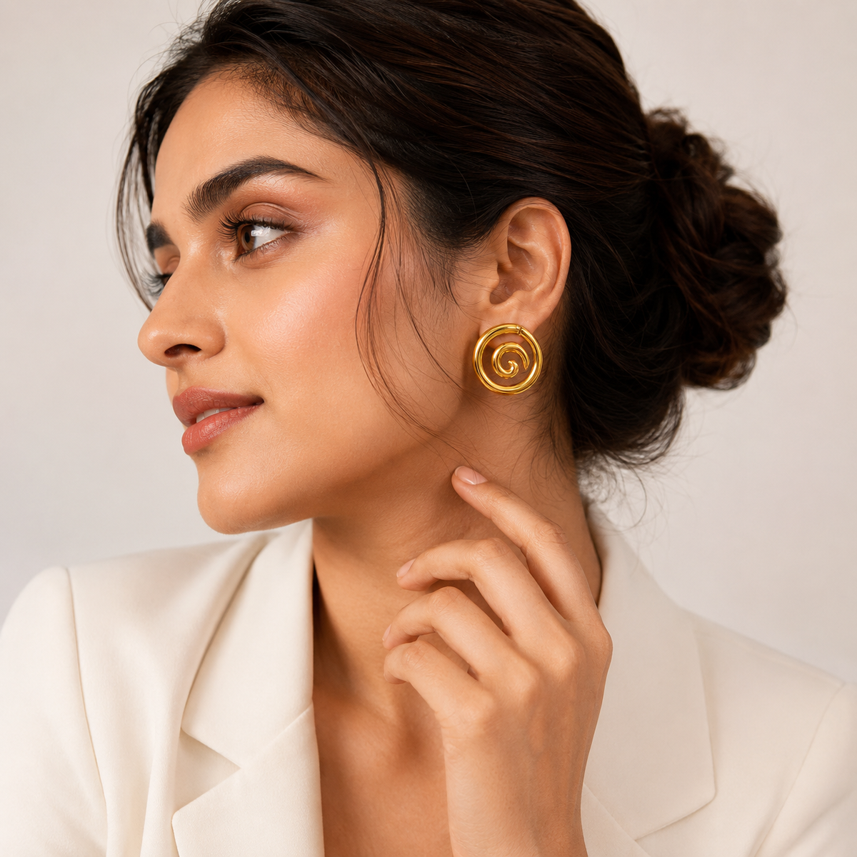 women wearing Amara Gold Plated Anti Tarnish Spiral Statement Stud Earrings