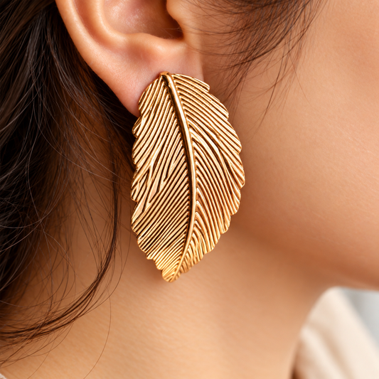 women wearing Gold Toned Chunky Feather Stud Earrings for Women