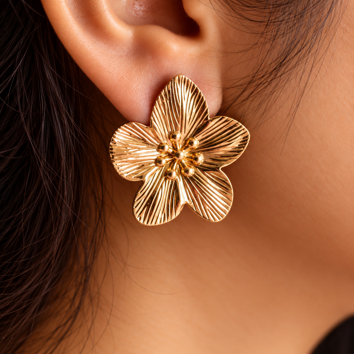 women wearing Gold Toned Chunky Flower Stud Earrings for Women
