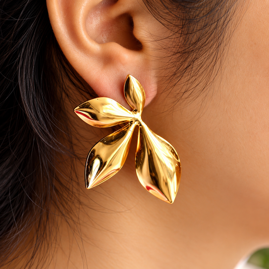 women wearing Gold Toned Chunky Four Petal Stud Earrings for Women