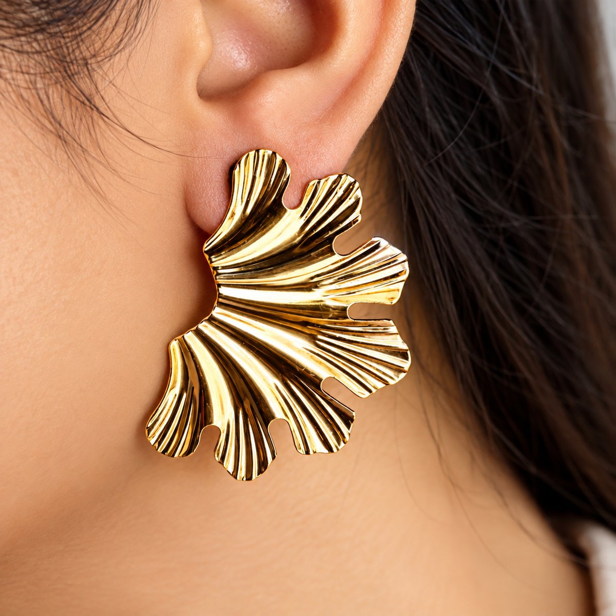 women wearing Gold Toned Chunky Half Petal Stud Earrings for Women