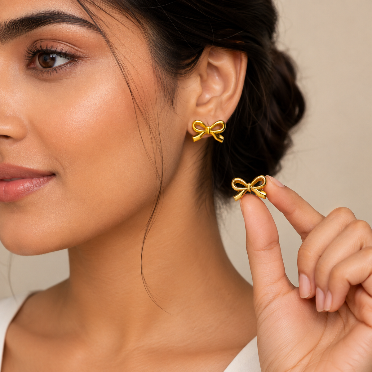 women wearing Liora Gold Plated Anti Tarnish Bow Stud Earrings