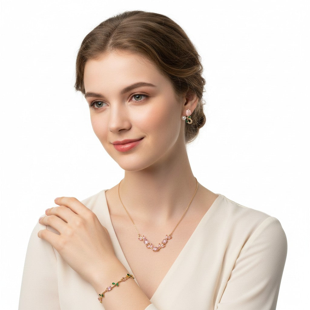 Woman wearing Tulipa Blush & Bloom Gold Plated Anti-Tarnish Jewellery Set for Women with matching Pink Tulip Necklace, Bracelet & Earrings on a white background